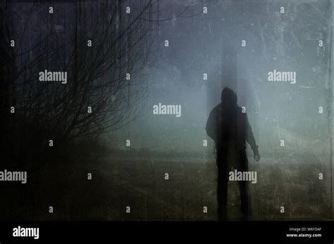 Hooded figure silhouette hi-res stock photography and images - Alamy