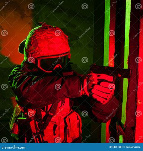 Special Forces Soldier Or Contractor During Night Mission Stock Image