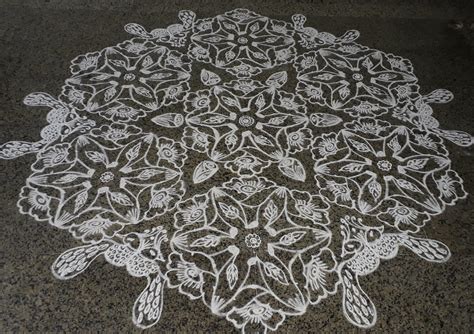 Interlaced Dots Flowers And Peacock Kolam Contest Kolam