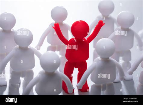Red Human Figure Surrounded By Team Stock Photo Alamy