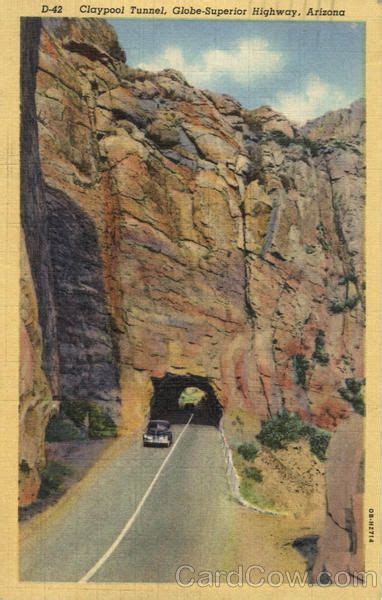 An Old Postcard Shows A Car Going Through A Tunnel In The Mountains