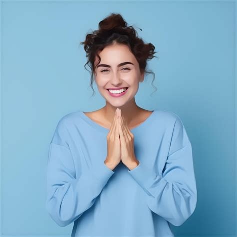 Premium Ai Image A Woman Smiling With Her Hands Together In Front Of Her Face