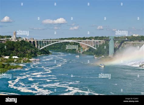 Rainbow Bridge between Canada and USA over the Niagara River in Niagara Falls. Ontario (left ...