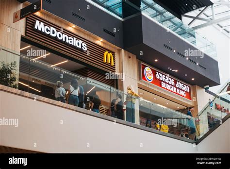 A Mcdonalds And Burger King Restaurants Next To Each Other At A