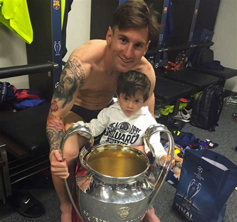 Lionel Messi And Son Pose With Champions League Trophy