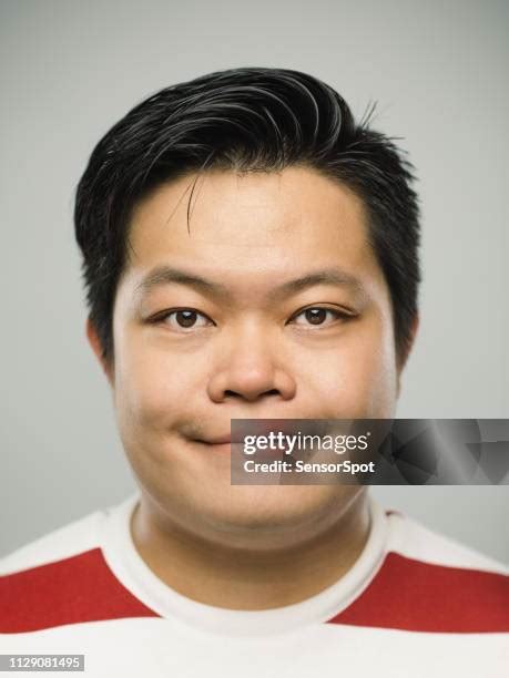 Asian Man Smirk Photos And Premium High Res Pictures Getty Images