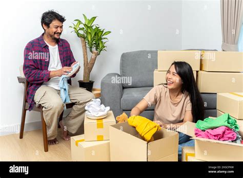 Couple Recycle Donate And Packing Boxes For Relocation While Moving
