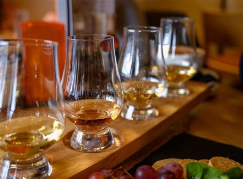 Flight Of Scottish Whisky Tasting Glasses With Variety Of Single Malts