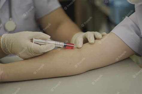 Premium Photo | Image blood drawing demonstration on the crook of the ...