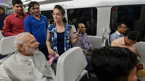 In Pics Pm Narendra Modi Surprises Delhi Metro Commuters Takes Ride In Airport Express For