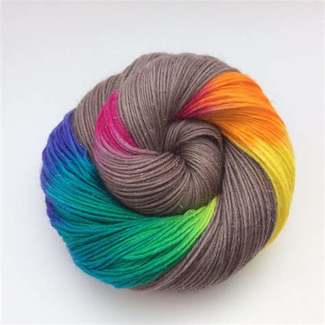 A Skein Of Multicolored Yarn On A White Surface