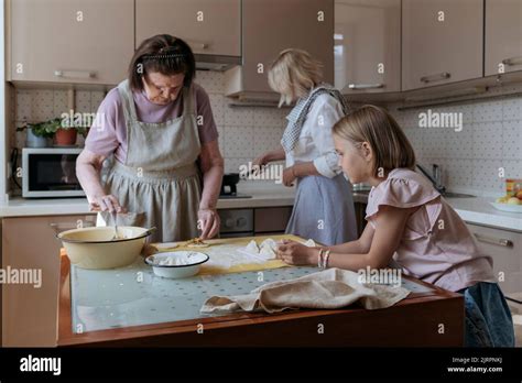 Three Women In The Kitchen Are Cooking Homemade Cakes Stock Photo Alamy