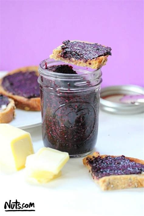 Blueberry Jam In A Jar With Slices Of Bread And Butter