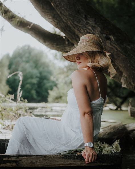 Free Picture A Woman Poses In Trousers A Hand Knitsweater And A White