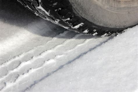 Premium Photo Wheel And Track In Snow