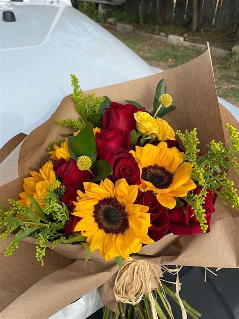 Sunflowers And Roses In Beautiful Bouquet Of Flowers