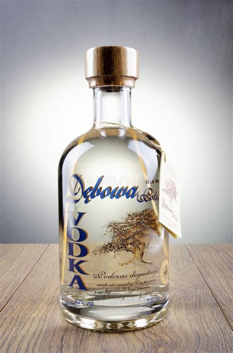 Debowa Vodka With Wooden Handle Isolated On Gradient Background