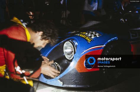 A Mechanics Work On The Front Lights On The Jean Pierre Jabouille