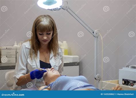 Beauty Clinic Woman Gets A Professional Facial Procedure Beautician