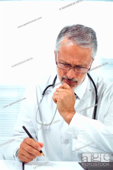 Doctor Writing On Notepad Stock Photo Picture And Low Budget Royalty