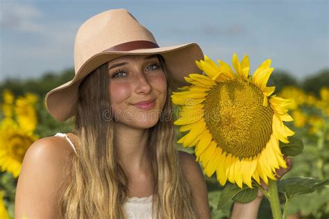 A Lovely Blonde Model Poses Outdoor While Enjoying The Summer Weather