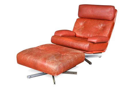 A Tetrad Nucleus Swivel Lounge Chair And Ottoman In Cheffins Fine Art