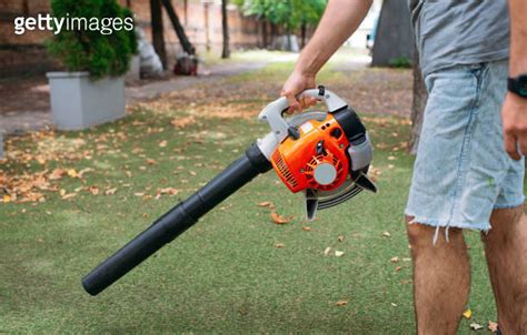 Cordless Leaf Blowers Handheld Cordless Electric Leaf Blower In A Garden Selective Focus