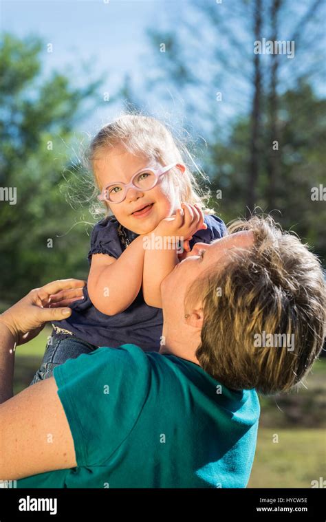 Mother Holding Down Syndrome Toddler Child Daughter Stock Photo Alamy