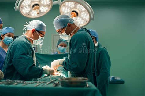 Operating Theatre Environment Doctors And Team Operating On A Patient