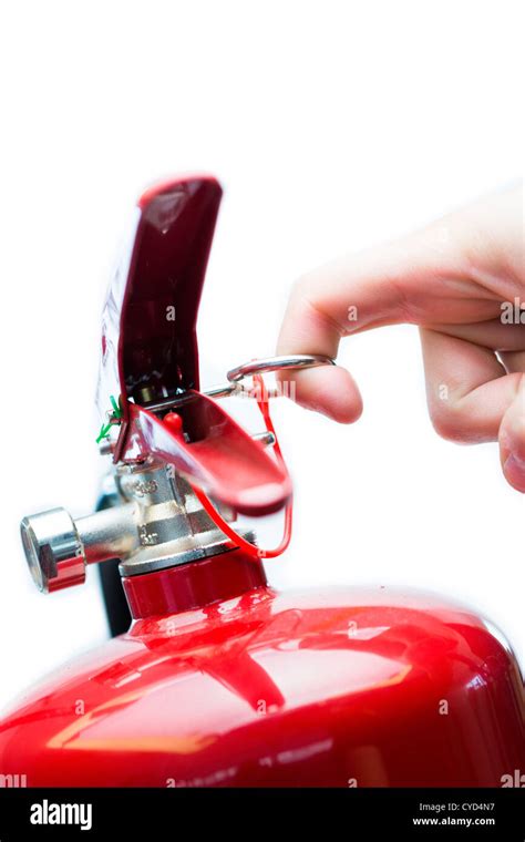 Hand Pulling Safety Pin From Fire Extinguisher Stock Photo Alamy