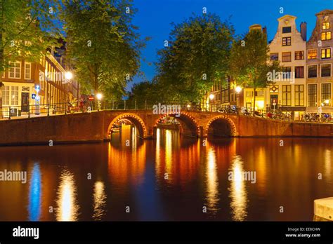 Night City View Of Amsterdam Canal And Bridge Holland Netherlands