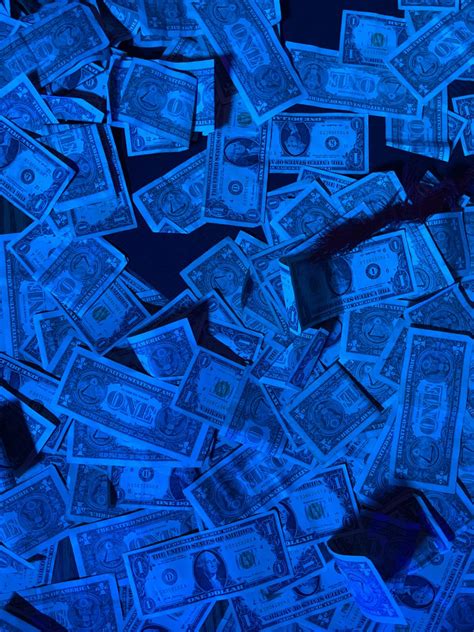 Glowing Dollar Bills In Dark Blue Light