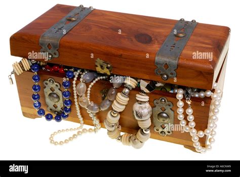 Treasure Chest Overflowing With Jewelry And Necklaces Stock Photo