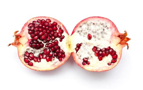 Premium Photo | Half pomegranate on a white