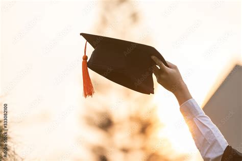 Close Up Graduate Student Put Hands Up And Celebrating With Graduation