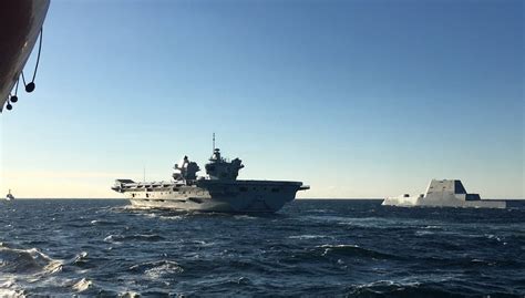 HMS Queen Elizabeth meets up with Zumwalt class destroyer USS Michael ...