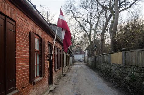 An Old Historical House With The Latvian Flag Kuldiga Latvia Stock