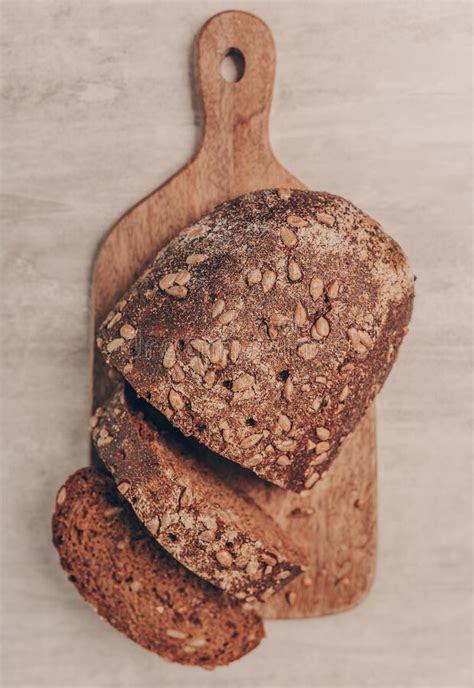 Fresh Tasty Sliced Wholemeal Bread With Sunflower Seeds On A Wooden