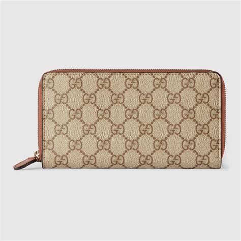 Portefeuille zippé GG Emblem en beige et marron foncé GUCCI Canada