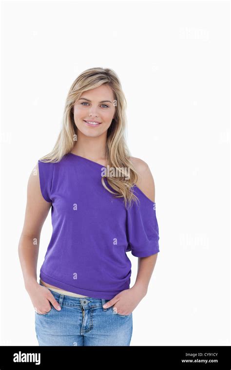 Smiling Blonde Woman Placing Her Hands In Her Pockets Stock Photo Alamy