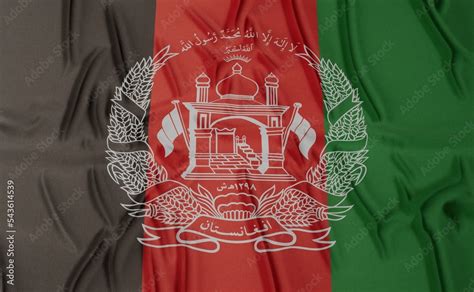 Flag of Afghanistan (Islamic Republic) - on a flat surface with a few ...