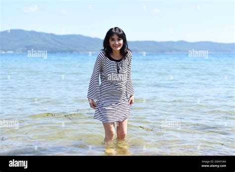 45 Years Old Russian Woman Laughing And Standing In Japanese Sea Stock