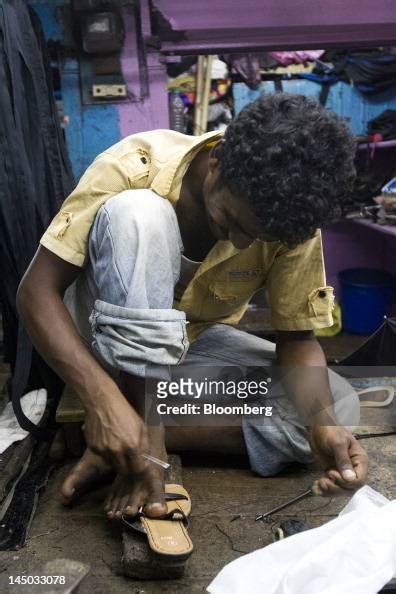 A Cobbler Repairs A Sandal At A Market Stall In Port Blair The News