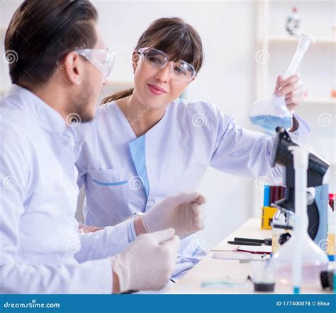 Team Of Chemists Working In The Lab Stock Photo Image Of Biology