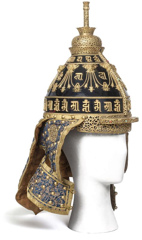 An Elaborately Decorated Helmet With Gold And Blue Decorations On The