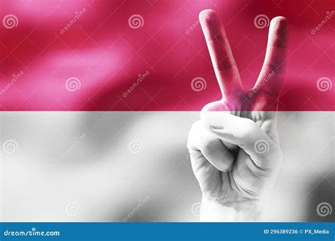 Indonesia Two Fingers Showing Peace Sign And National Flag Stock