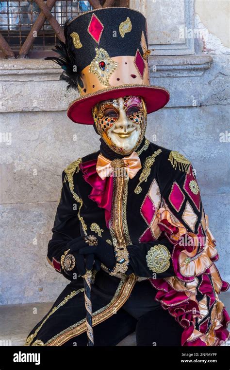 Carnival Goer Dressed In Splendid Costume And Mask During Venice