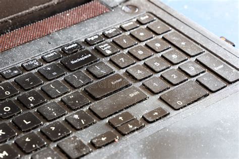 Close Up On Dirty And Unhygienic Computer Laptop Keyboard Full Of Dust