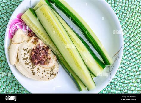 Snack Of Hummus And Cucumber Slices Stock Photo Alamy