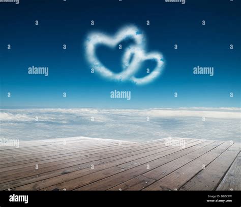 Two Heart Shaped Clouds In The Blue Sky Stock Photo Alamy